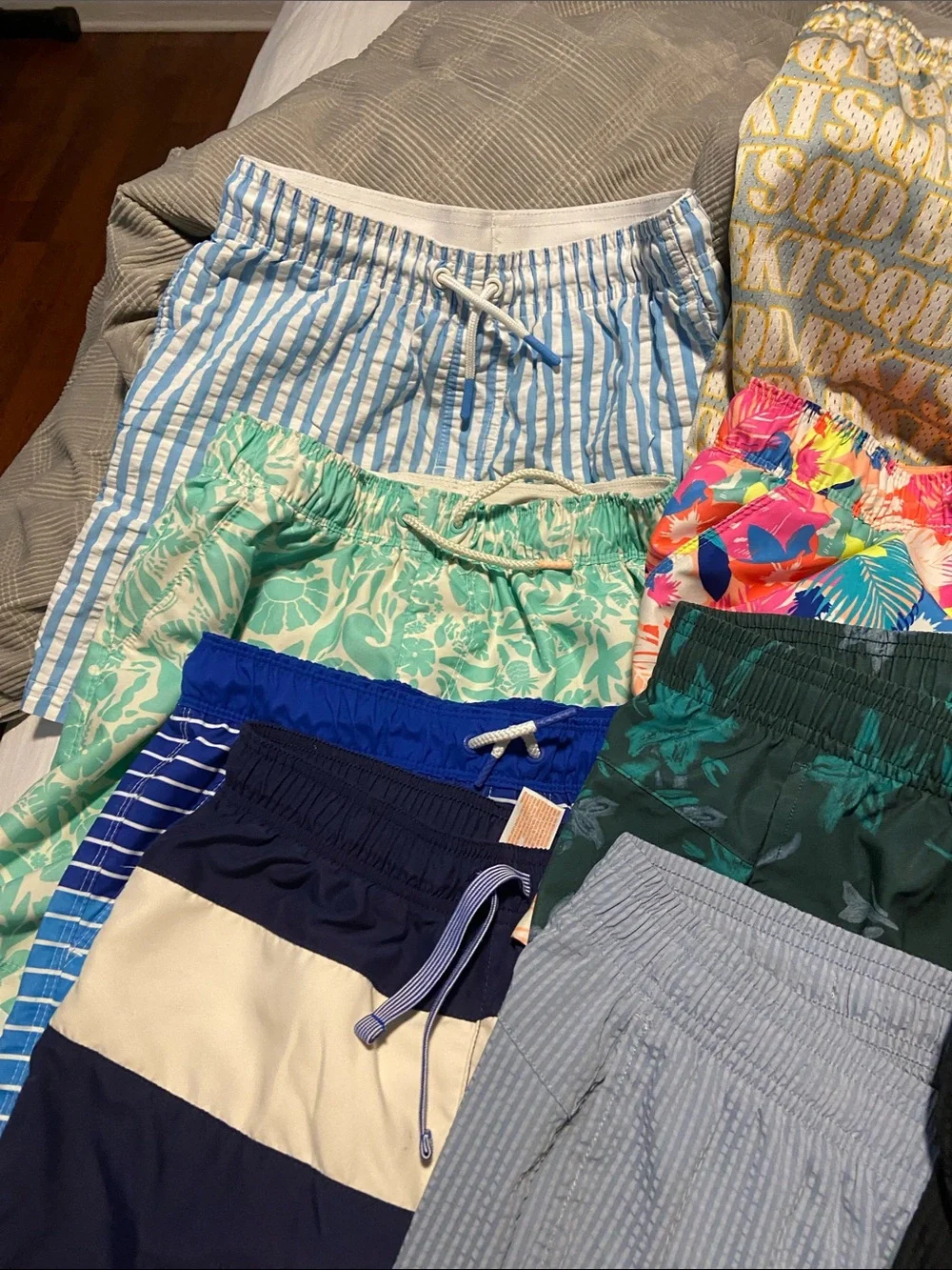 Boys clothing lot Ten pair of shirts/bathing suits Three t shirts one wth tags